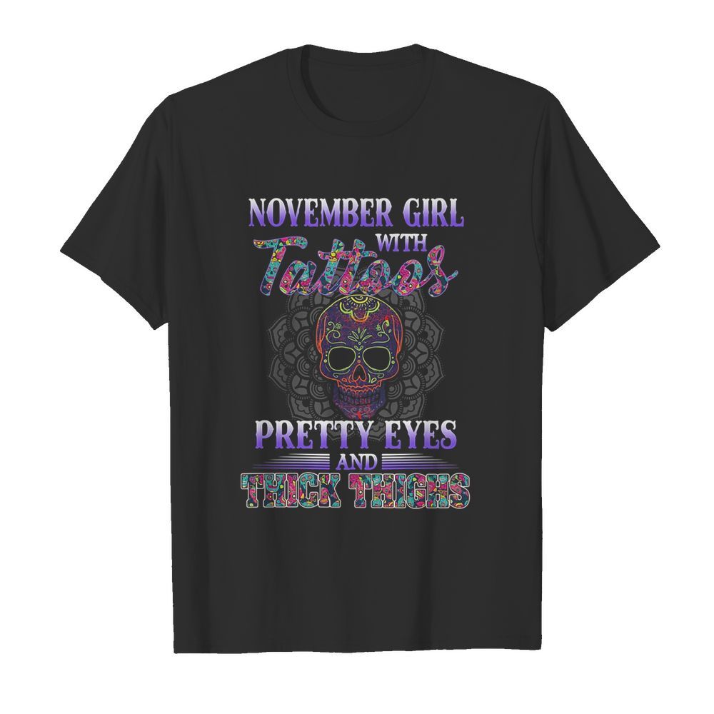 November girl with tattoos pretty eyes and thick thighs skull shirt